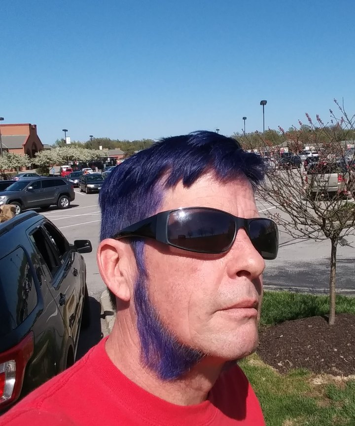 Todd before his transformation — sunglasses, looking away
