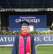Todd in cap and gown on graduation day, 2018